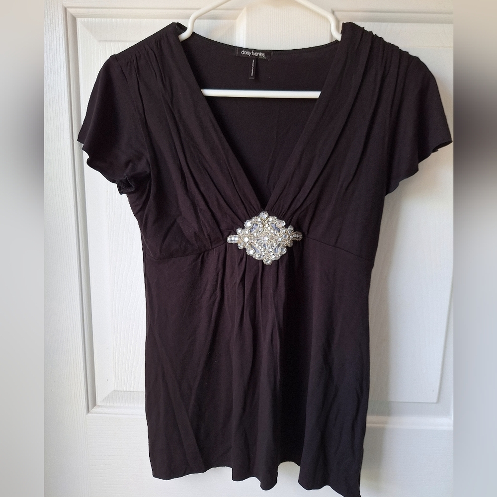 SM black Daisy Fuentes top embellished with glamorous silver beaded ornament.